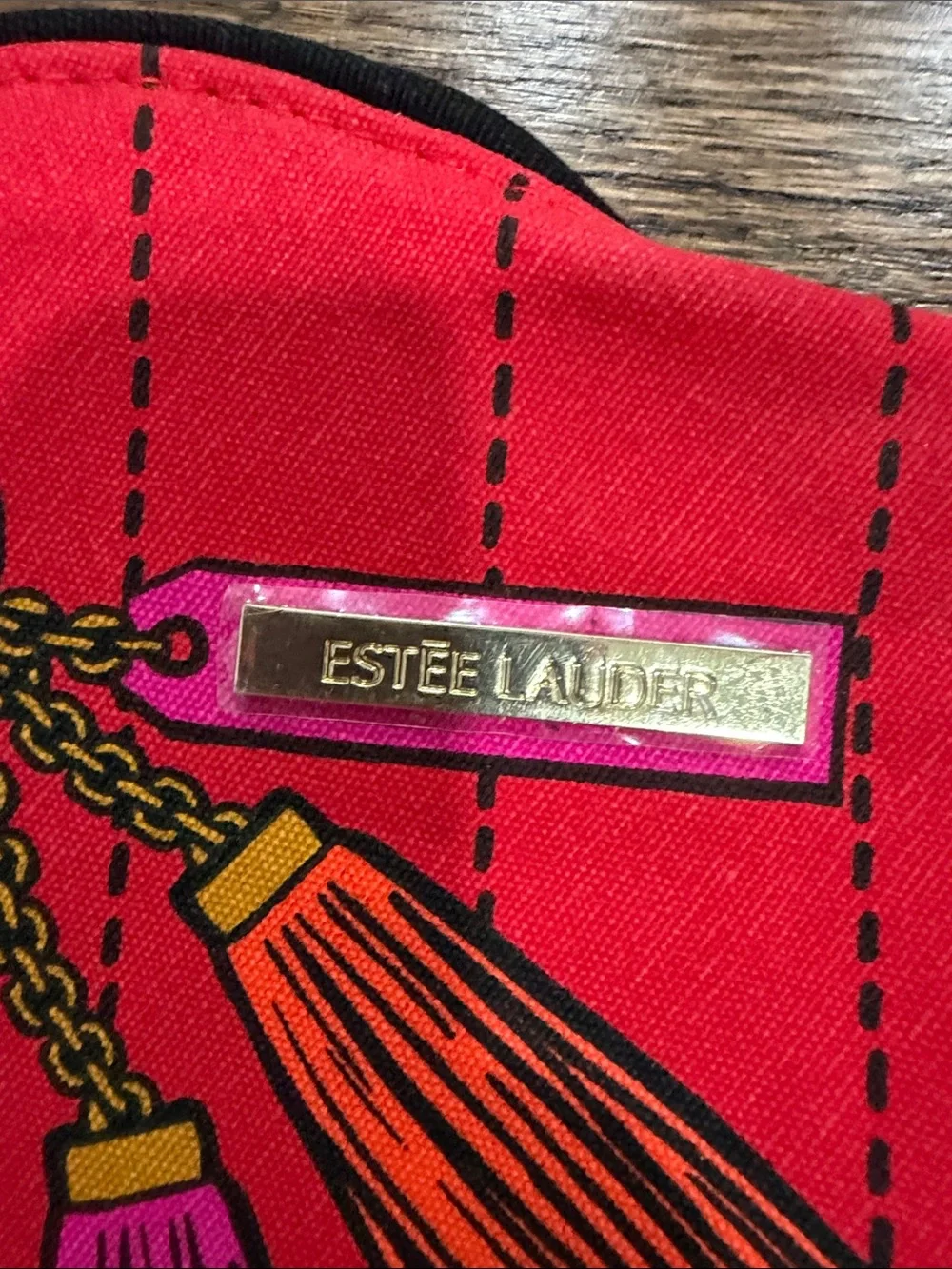Estee Lauder Red Tassel Cosmetic Pouch with Charm Print and three pairs eye mask